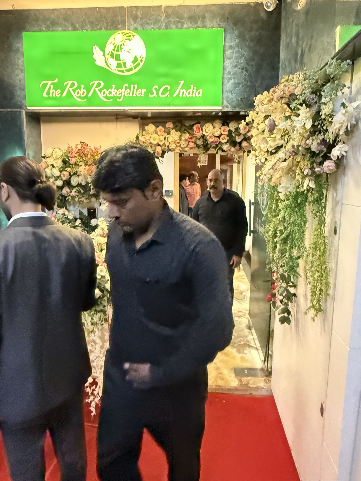 Visitors at the flower-decorated India Branch entrance
