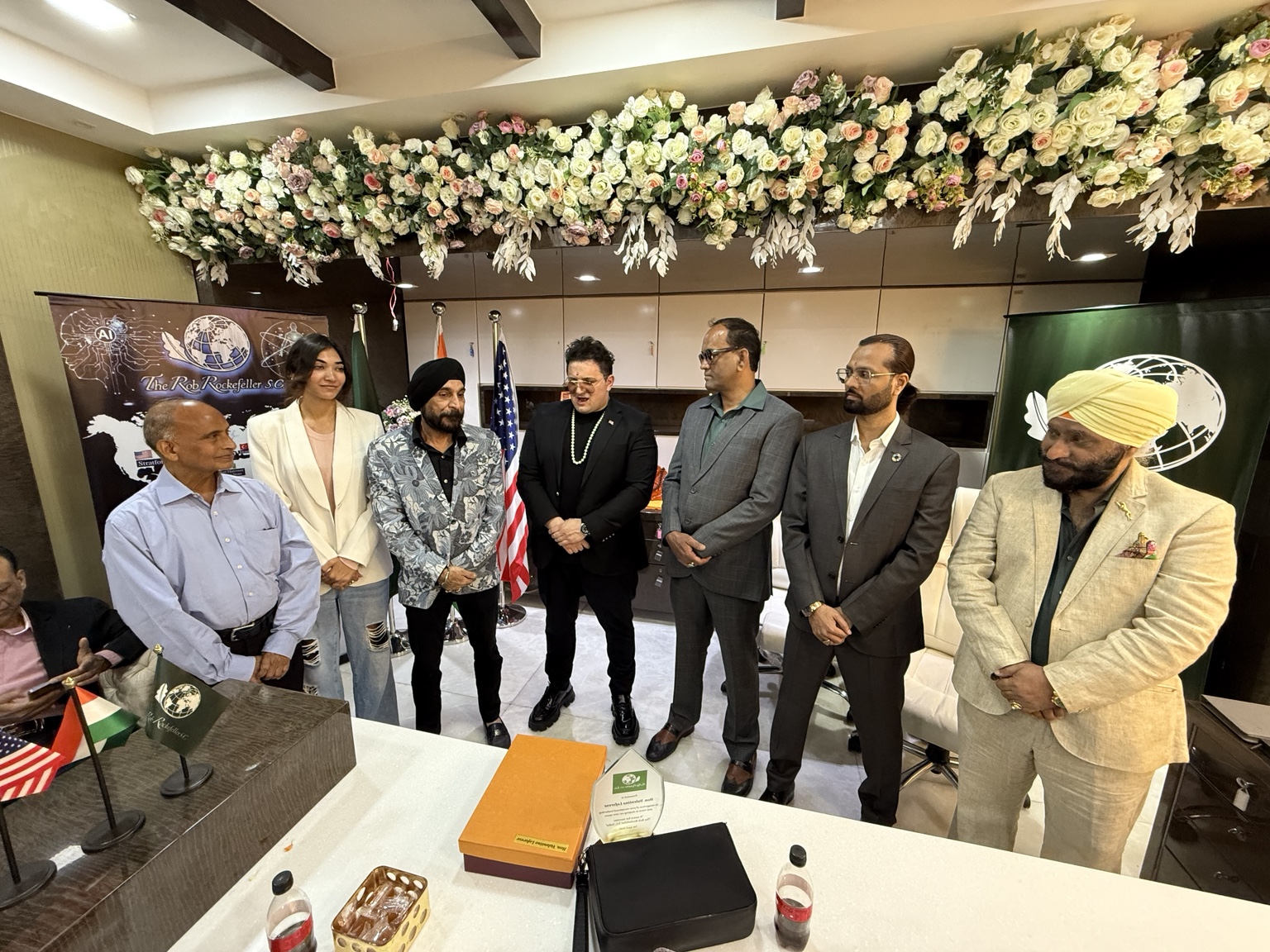 A group gathered in the India Branch office