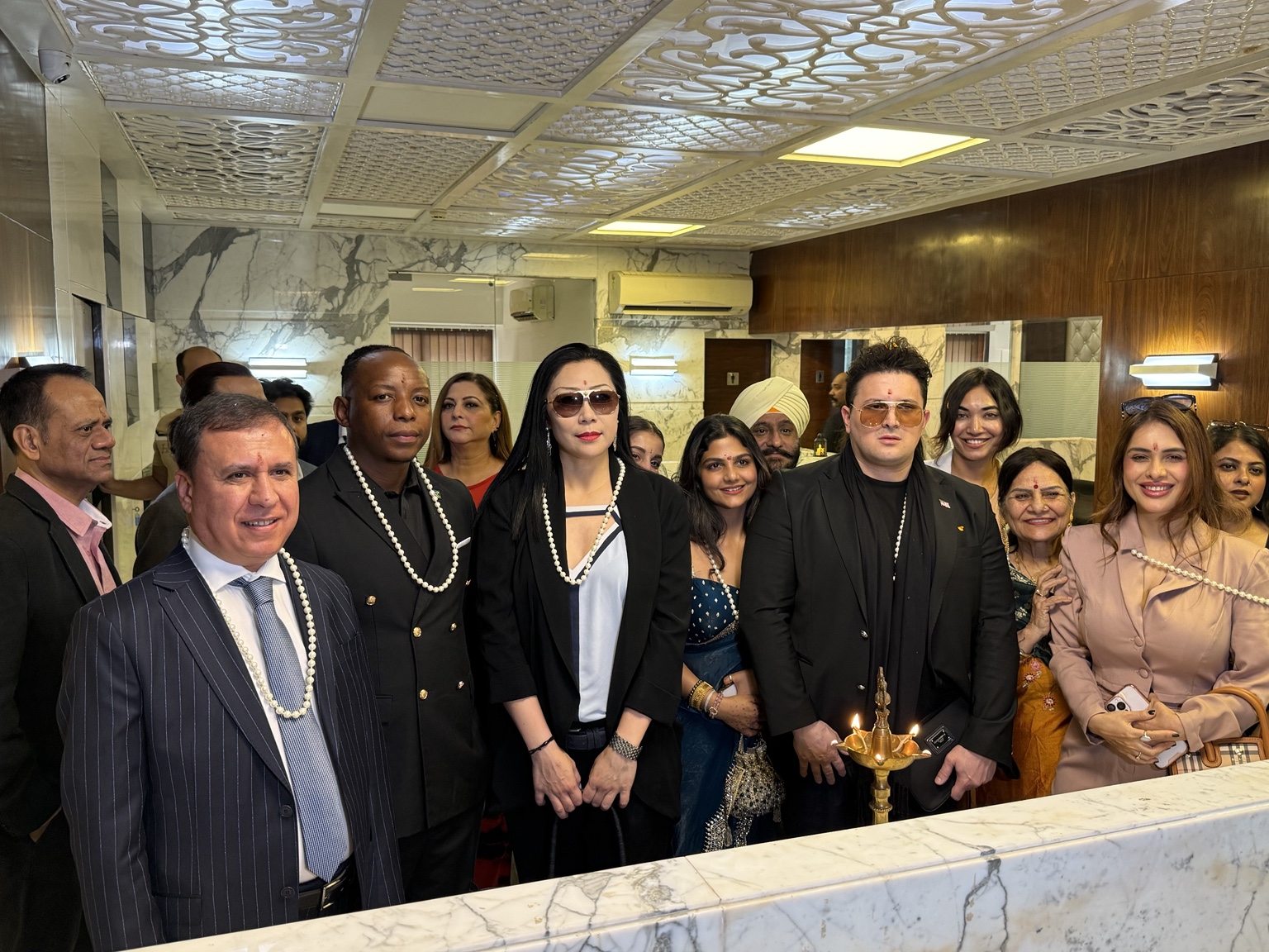 Guests gathered around a ceremonial lamp at the India Branch inauguration