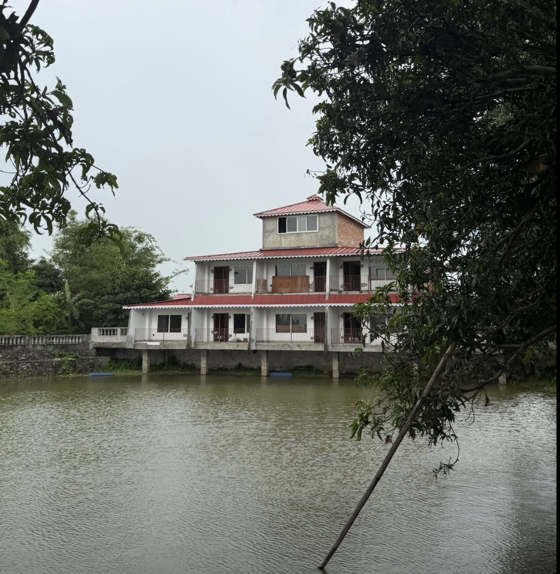 Pond-side building — Ratuwamai, Koshi Province, Nepal