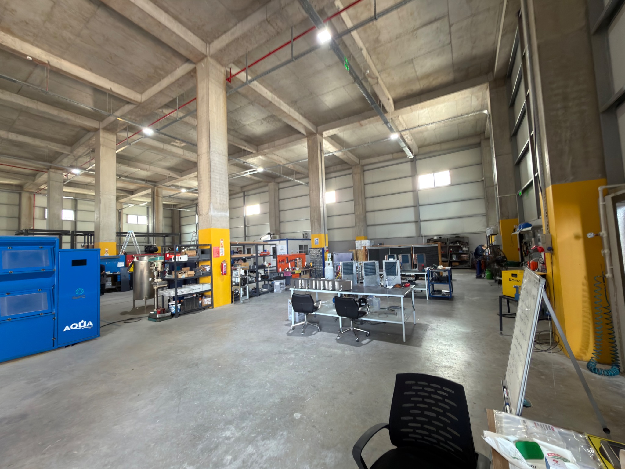 Workshop interior showing equipment, benches and production areas.