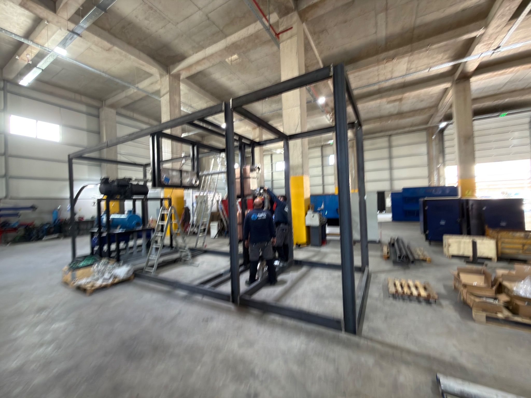 Wide view of the equipment frame and surrounding assembly space.