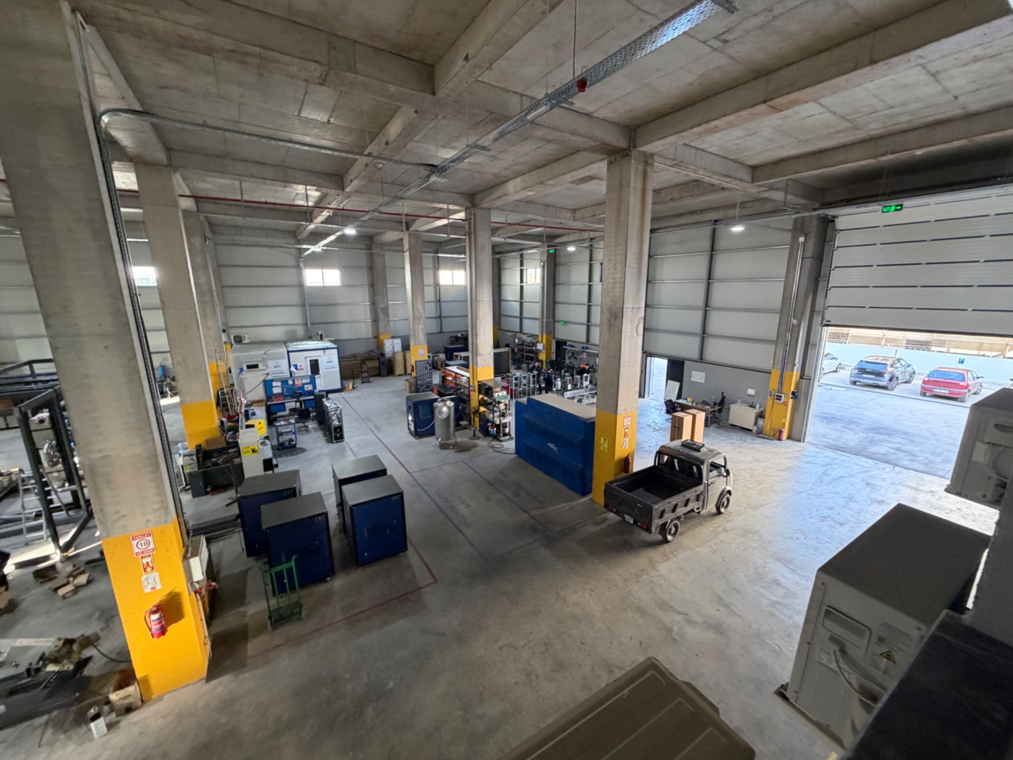 A second elevated view of the workshop, machinery and production space.