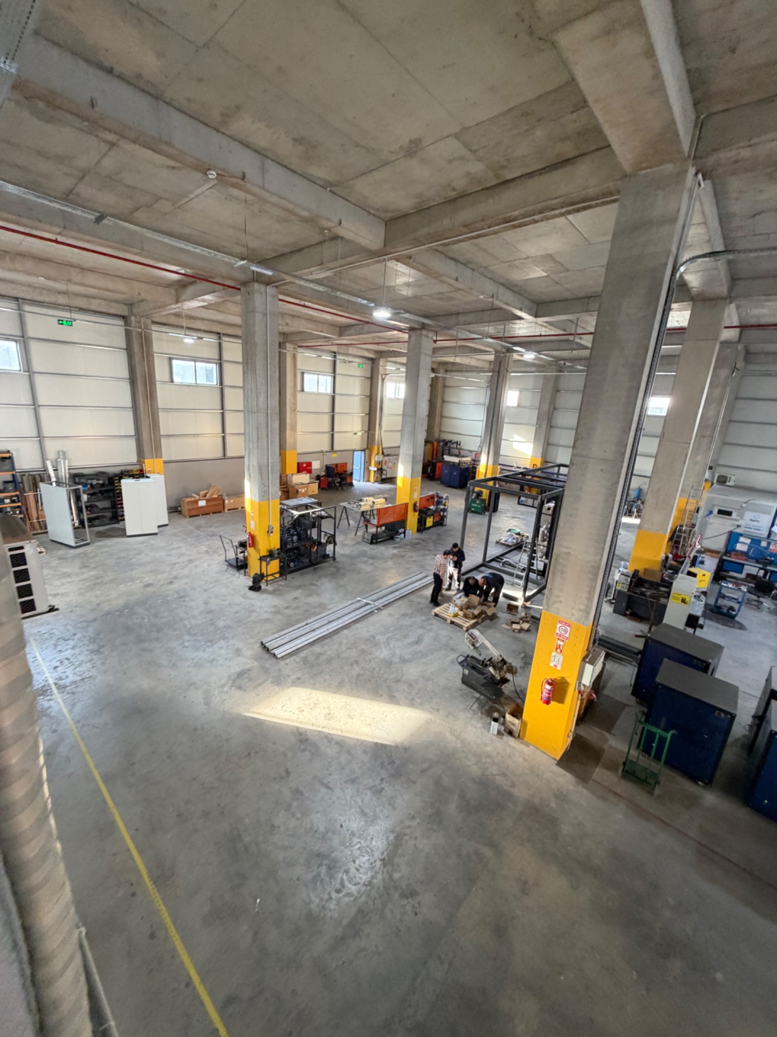 Full height elevated view of the workshop and assembly areas.