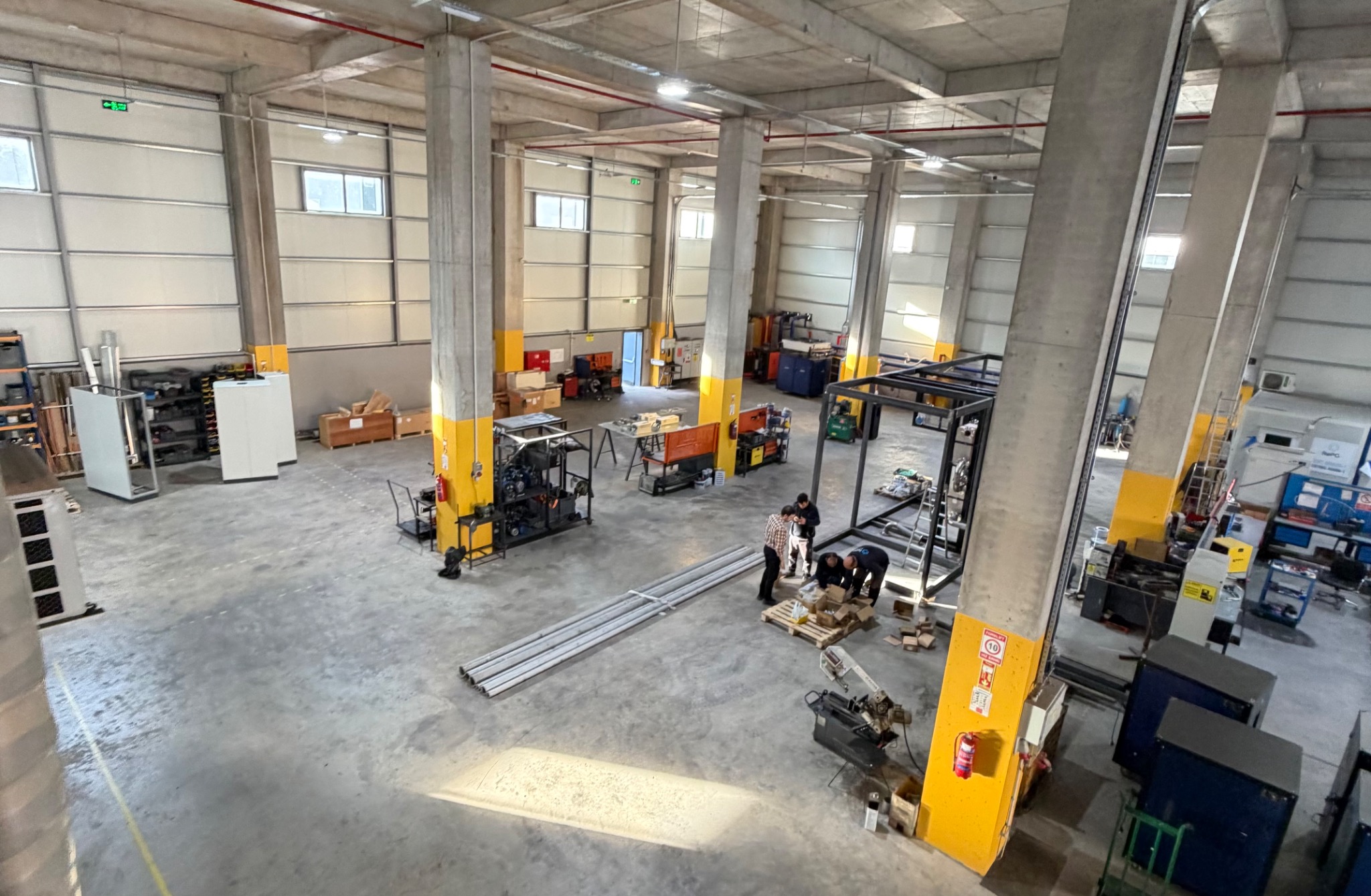Elevated view across the engineering workshop and equipment assembly areas.