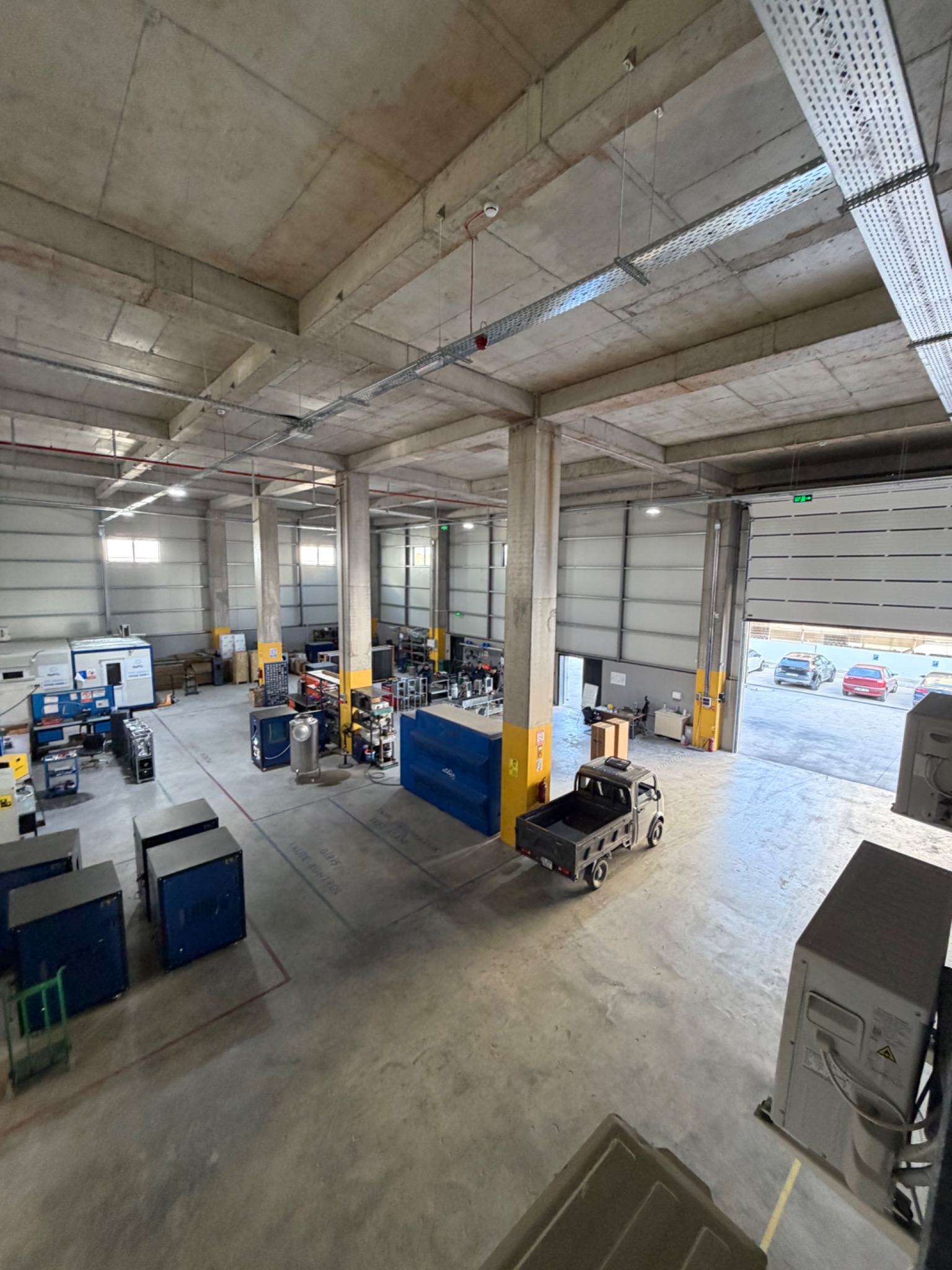 Full height overview of machinery and working areas inside the facility.