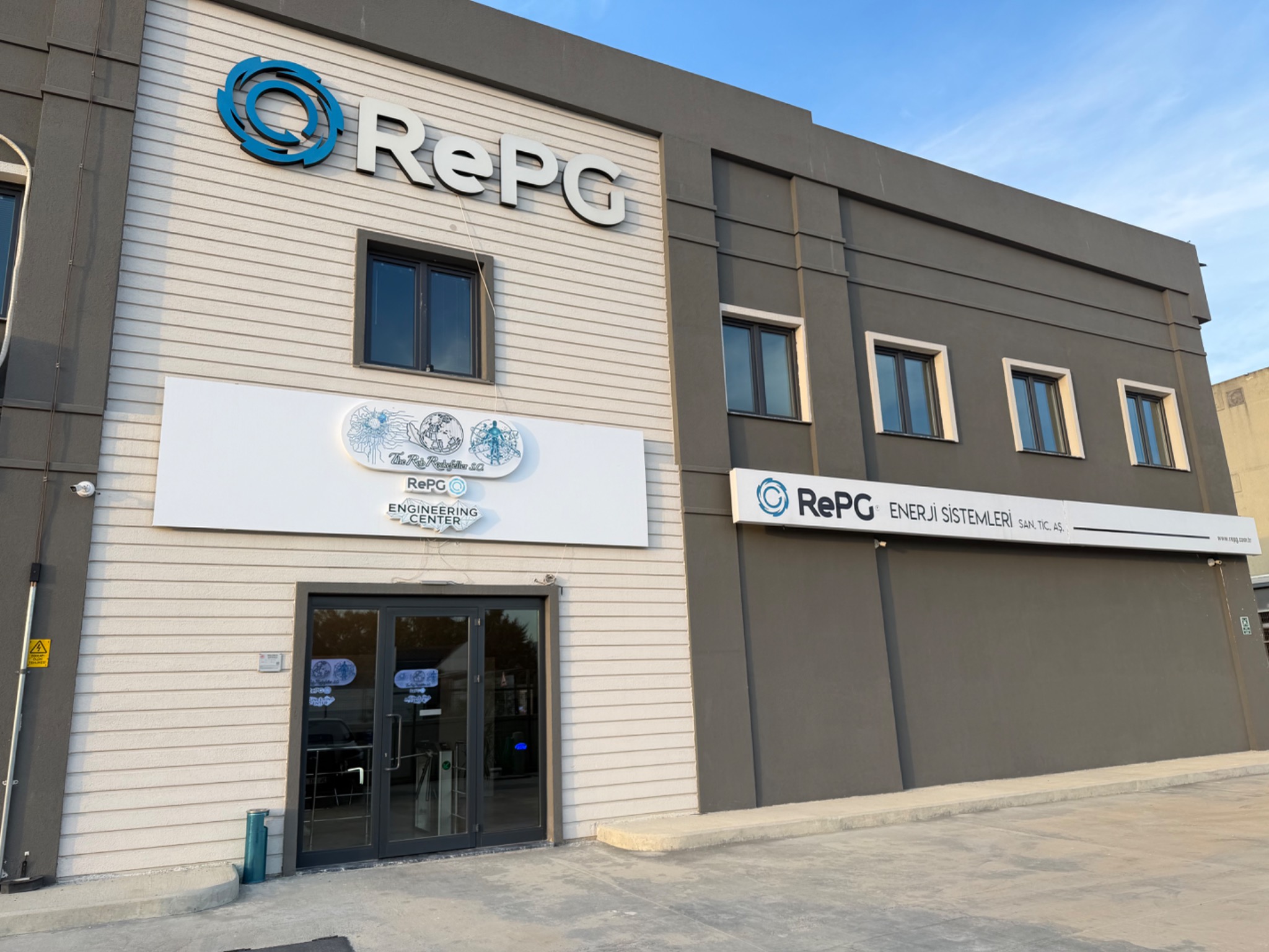 Exterior of the Bursa facility, with RePG and shared engineering center signage.