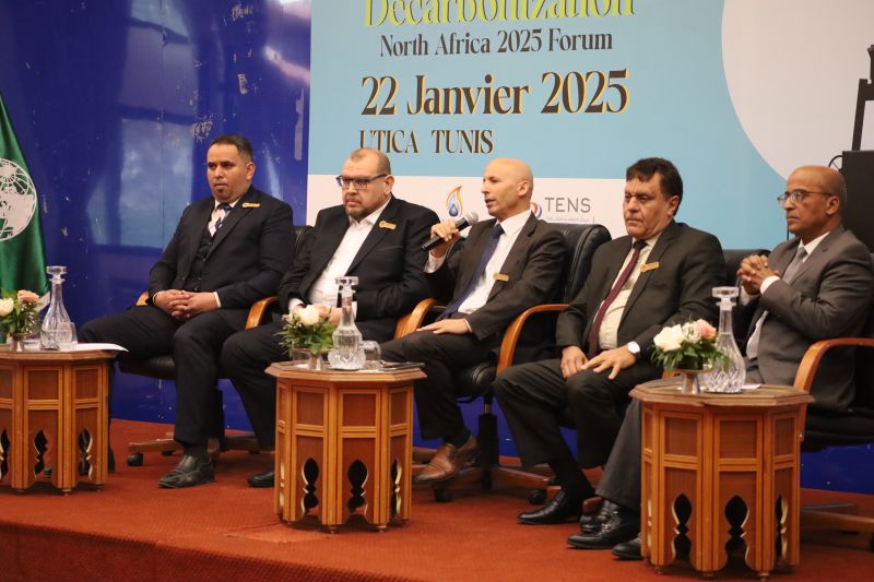 Panel participants seated together on stage during a discussion