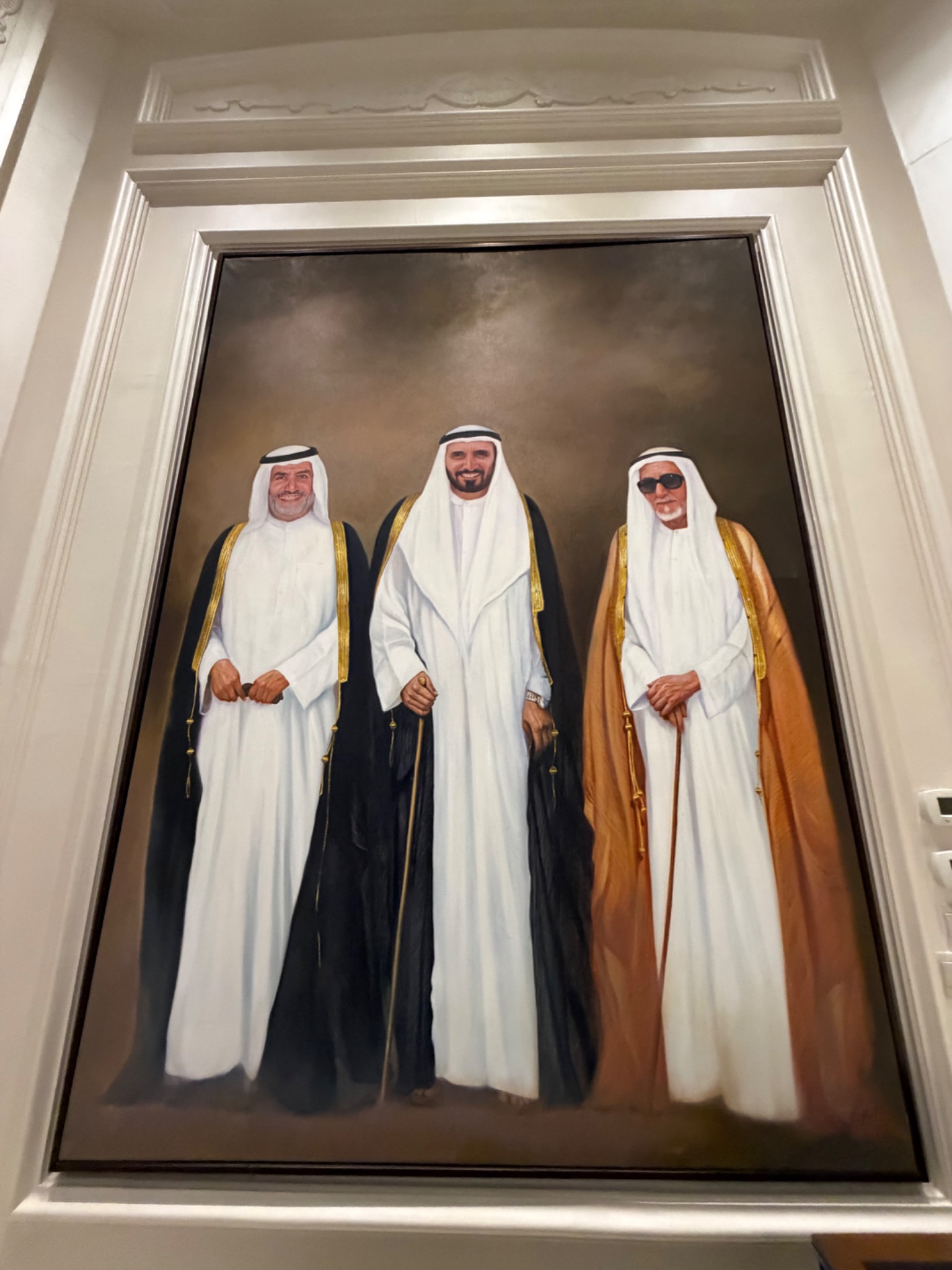 A framed group portrait displayed inside Sheikh Awad’s private residence.